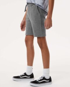 Independent Trading Co. PRM16SRT Youth Lightweight Special Blend Fleece Shorts – Nickel (on model side)