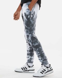 J. America 8884 Unisex Tie-Dyed Fleece Joggers – Black Tie Dye (on model side)