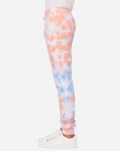 J. America 8884 Unisex Tie-Dyed Fleece Joggers – Sunset Tie Dye (on model side)