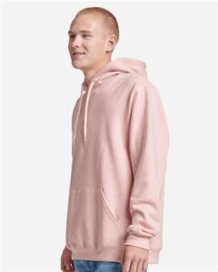 JERZEES 700MR Unisex Eco™ Premium Blend Ring-Spun Hooded Sweatshirt – Blush Pink (on model side)