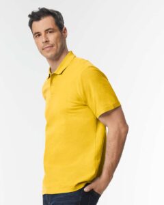 Gildan 64800 Unisex Softstyle® Pique Polo – Daisy (on model side)