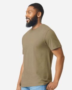 Gildan 64000CVC Unisex Softstyle® CVC T-Shirt – Dune Mist (on model side)
