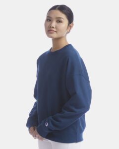 Champion SL650 Women’s Powerblend® Crewneck Sweatshirt – Late Night Blue (on model side)