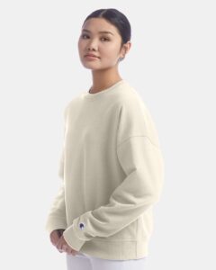 Champion SL650 Women’s Powerblend® Crewneck Sweatshirt – Sand (on model side)