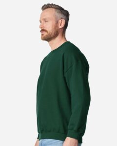 Gildan 18000 Unisex Heavy Blend™ Crewneck Sweatshirt – Fan Dark Green (on model side)