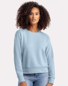 Next Level 9084 Women’s Laguna Sueded Crewneck Sweatshirt – Stonewash Denim (on model)