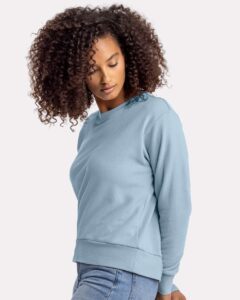 Next Level 9084 Women’s Laguna Sueded Crewneck Sweatshirt – Stonewash Denim (on model side)