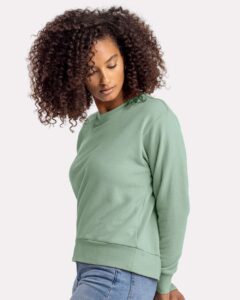 Next Level 9084 Women’s Laguna Sueded Crewneck Sweatshirt – Stonewash Green (on model side)