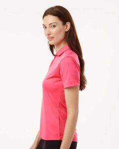 AllPro 41800L Women’s Pro-Lock Performance Polo – Bright Pink (on model side)
