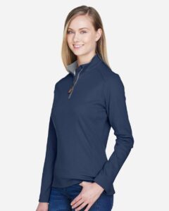 Devon & Jones DG479W Women’s DRYTEC20™ Performance Quarter-Zip Pullover – Navy/ Grey Heather/ Graphite (on model side)