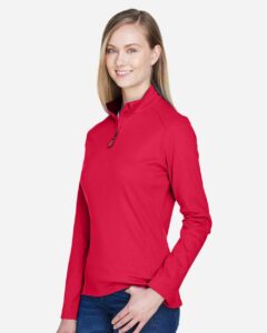 Devon & Jones DG479W Women’s DRYTEC20™ Performance Quarter-Zip Pullover – Red/ Navy/ Red (on model side)