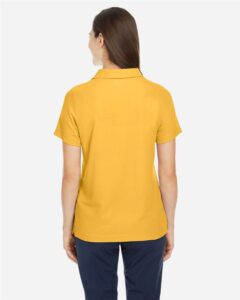 CORE365 CE112W Women’s Fusion ChromaSoft™ Pique Polo – Campus Gold (on model back)