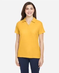CORE365 CE112W Women’s Fusion ChromaSoft™ Pique Polo – Campus Gold (on model)