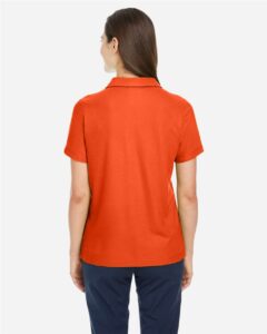 CORE365 CE112W Women’s Fusion ChromaSoft™ Pique Polo – Campus Orange (on model back)