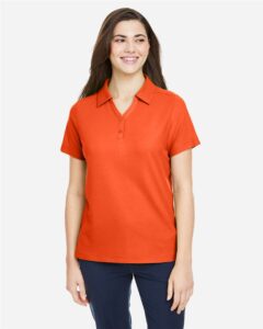 CORE365 CE112W Women’s Fusion ChromaSoft™ Pique Polo – Campus Orange (on model)