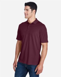 CORE365 88181 Men’s Origin Performance Piqué Polo – Burgundy (on model side)