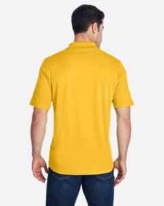 CORE365 88181 Men’s Origin Performance Piqué Polo – Campus Gold (on model back)