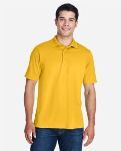 CORE365 88181 Men’s Origin Performance Piqué Polo – Campus Gold (on model)