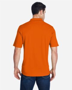 CORE365 88181 Men’s Origin Performance Piqué Polo – Campus Orange (on model back)