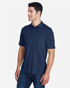 CORE365 88181 Men’s Origin Performance Piqué Polo – Classic Navy (on model side)