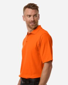 CORE365 CE106 Men’s Resolve CVC Performance Pique Polo – Campus Orange (on model side)