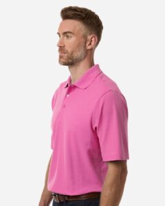 CORE365 CE106 Men’s Resolve CVC Performance Pique Polo – Charity Pink (on model side)