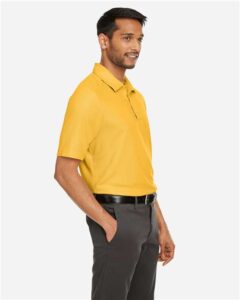 CORE365 CE112 Men’s Fusion ChromaSoft™ Pique Polo – Campus Gold (on model side)