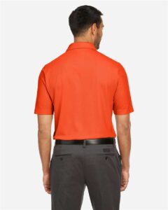 CORE365 CE112 Men’s Fusion ChromaSoft™ Pique Polo – Campus Orange (on model back)