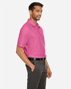 CORE365 CE112 Men’s Fusion ChromaSoft™ Pique Polo – Charity Pink (on model side)