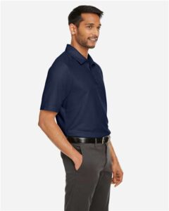 CORE365 CE112 Men’s Fusion ChromaSoft™ Pique Polo – Classic Navy (on model side)