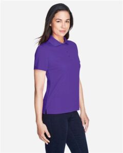 CORE365 78181 Women’s Origin Performance Piqué Polo – Campus Purple (on model side)
