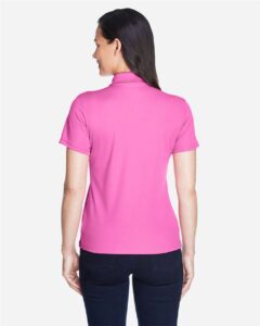 CORE365 78181 Women’s Origin Performance Piqué Polo – Charity Pink (on model back)
