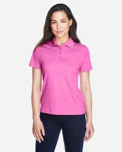 CORE365 78181 Women’s Origin Performance Piqué Polo – Charity Pink (on model)