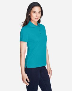 CORE365 78181 Women’s Origin Performance Piqué Polo – Clear Teal (on model side)