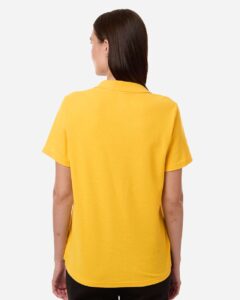 CORE365 CE106W Women’s Resolve CVC Performance Pique Polo – Campus Gold (on model back)