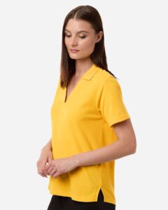 CORE365 CE106W Women’s Resolve CVC Performance Pique Polo – Campus Gold (on model side)