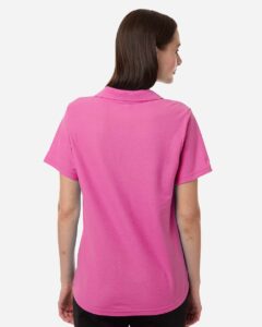 CORE365 CE106W Women’s Resolve CVC Performance Pique Polo – Charity Pink (on model back)