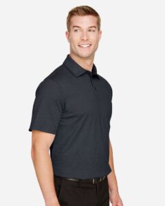 Devon & Jones DG22 Men’s CrownLux Performance® Address Mélange Polo – Black Melange (on model side)