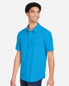 CORE365 CE510 Men’s Ultra UVP® Marina Shirt – Electric Blue (on model side)