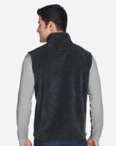 CORE365 88191 Men’s Journey Fleece Vest – Heather Charcoal (on model back)