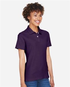 Devon & Jones DG150W Women’s DRYTEC20™ Performance Polo – Deep Purple (on model side)