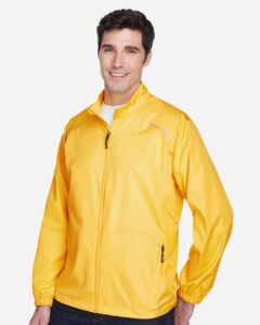 CORE365 88183 Men’s Techno Lite Motivate Unlined Lightweight Jacket – Campus Gold (on model side)