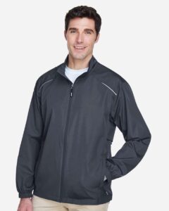 CORE365 88183 Men’s Techno Lite Motivate Unlined Lightweight Jacket – Carbon (on model side)