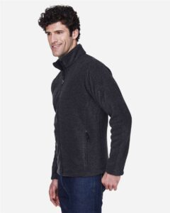 CORE365 88190 Men’s Journey Fleece Jacket – Heather Charcoal (on model side)