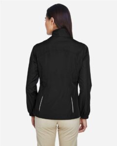 CORE365 78183 Women’s Techno Lite Motivate Unlined Lightweight Jacket – Black (on model back)