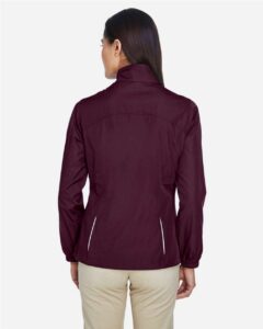CORE365 78183 Women’s Techno Lite Motivate Unlined Lightweight Jacket – Burgundy (on model back)