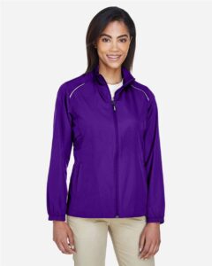 CORE365 78183 Women’s Techno Lite Motivate Unlined Lightweight Jacket – Campus Purple (on model)