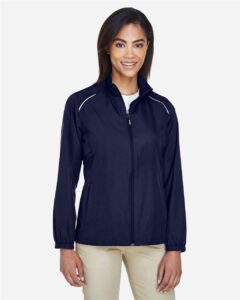 CORE365 78183 Women’s Techno Lite Motivate Unlined Lightweight Jacket – Classic Navy (on model)