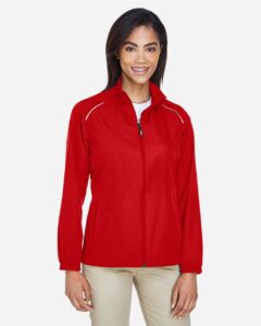 CORE365 78183 Women’s Techno Lite Motivate Unlined Lightweight Jacket – Classic Red (on model)
