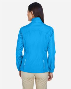 CORE365 78183 Women’s Techno Lite Motivate Unlined Lightweight Jacket – Electric Blue (on model back)
